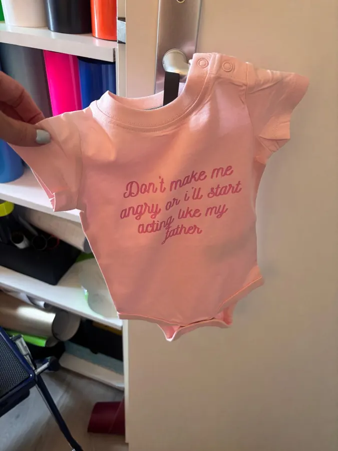 Roze rompertje met grappige tekst